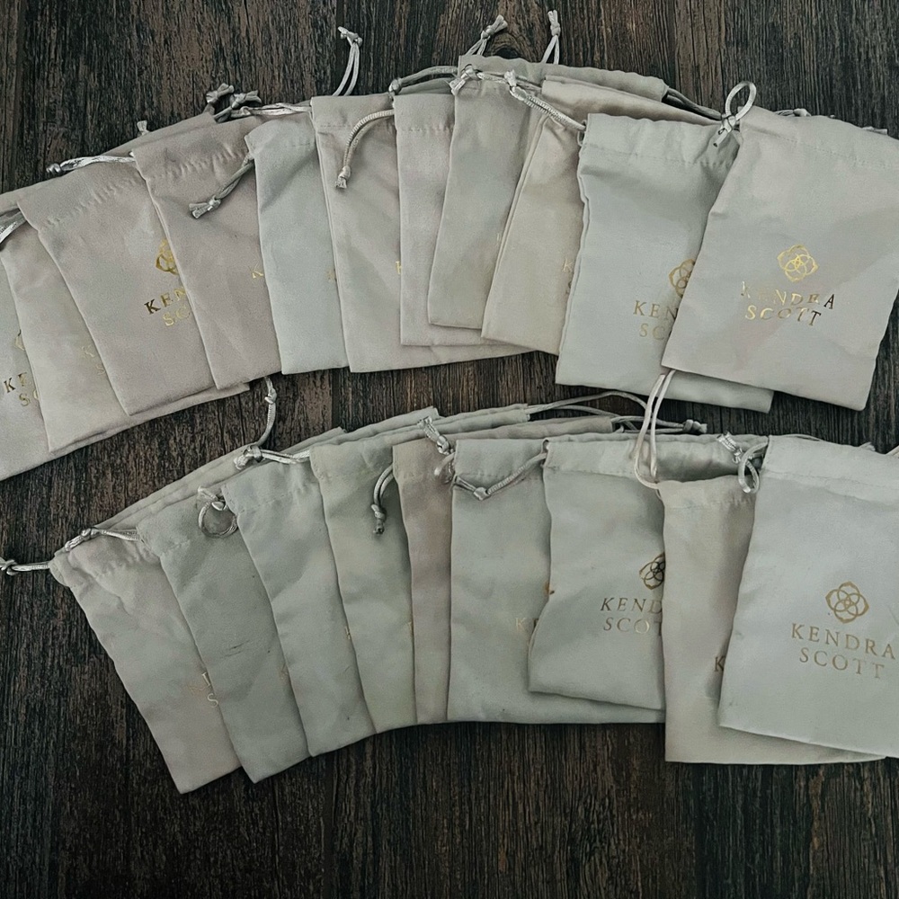 Kendra Scott Cream Pouches with Gold Logo